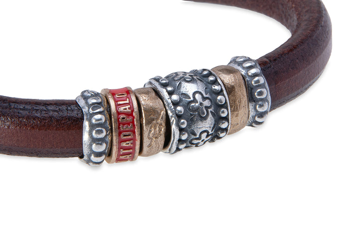 Leather bracelet with silver and bronze pieces