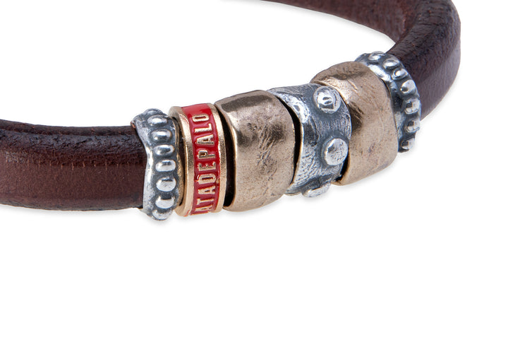 Leather bracelet with silver and bronze pieces