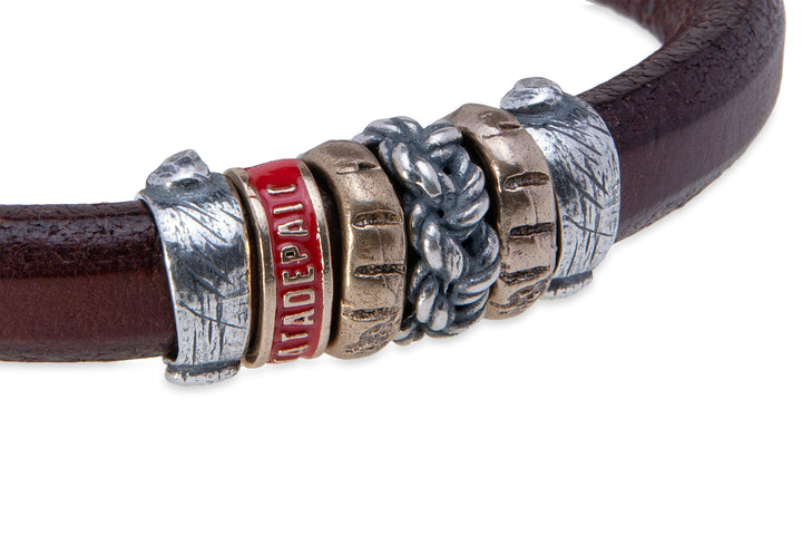 Leather bracelet with silver and bronze pieces