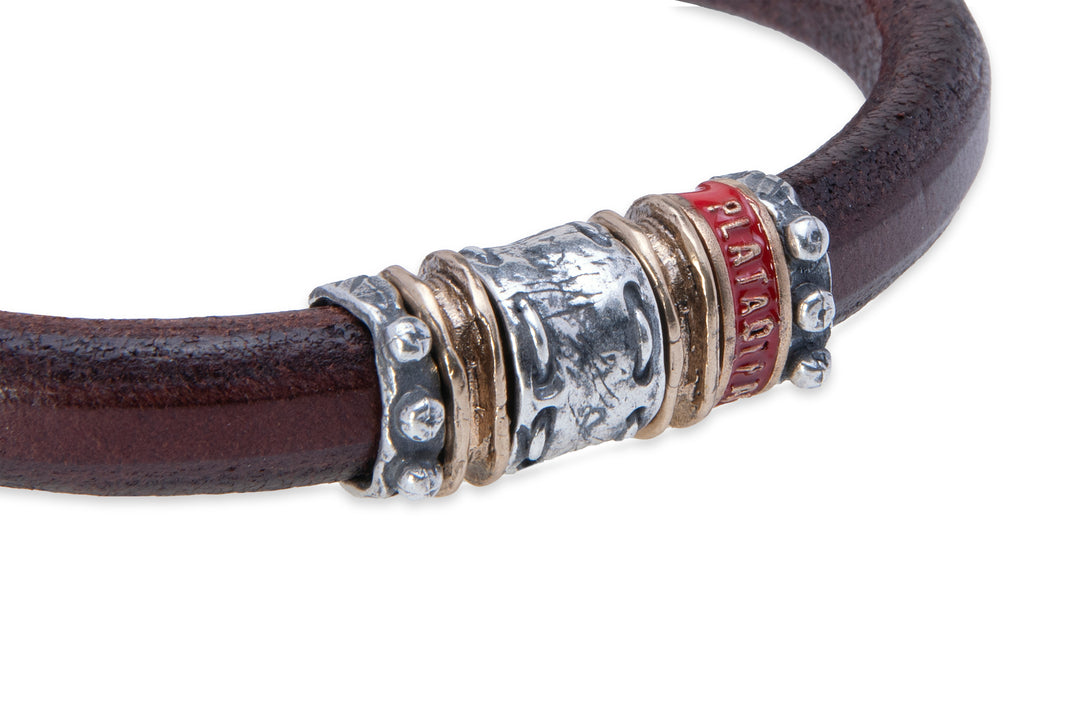 Leather bracelet with silver and bronze pieces