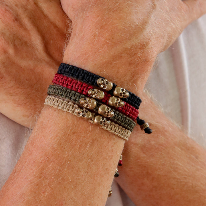 Garnet nylon bracelet with bronze skulls