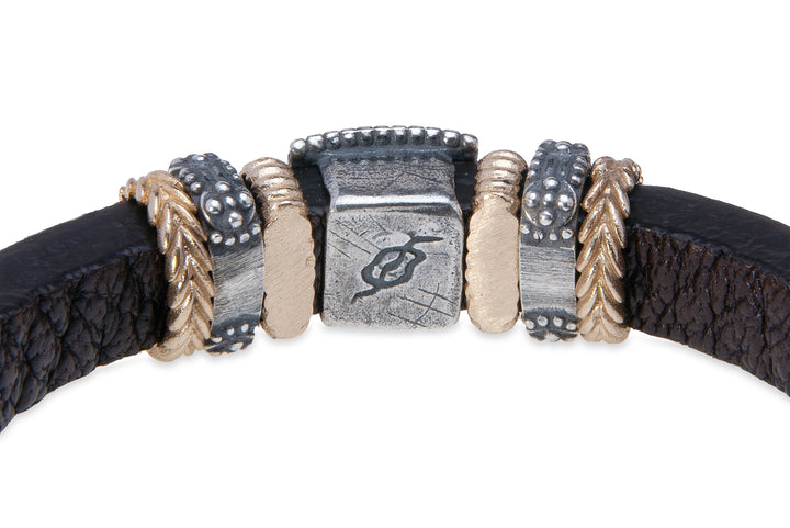 Leather bracelet with silver, bronze and zircon pieces