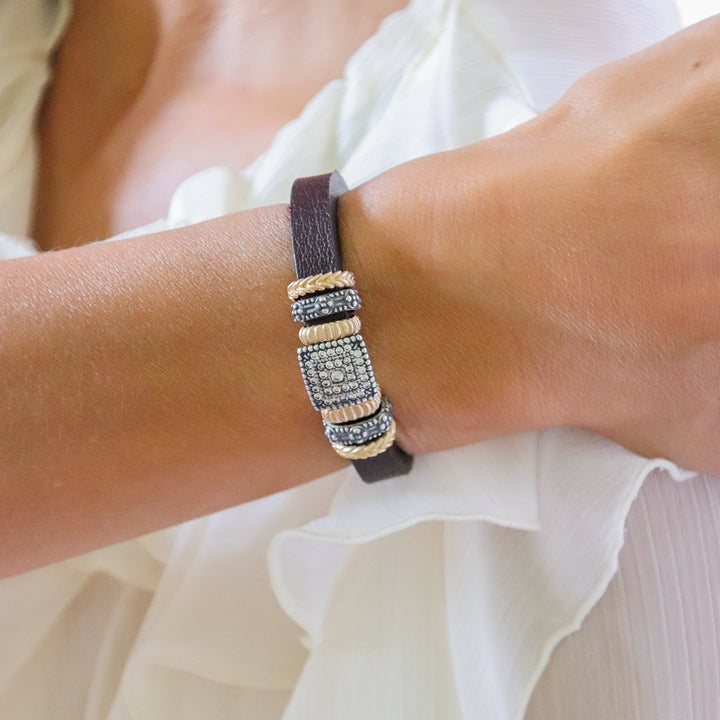 Leather bracelet with silver, bronze and zircon pieces