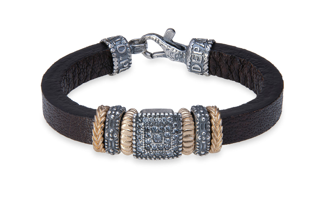 Leather bracelet with silver, bronze and zircon pieces