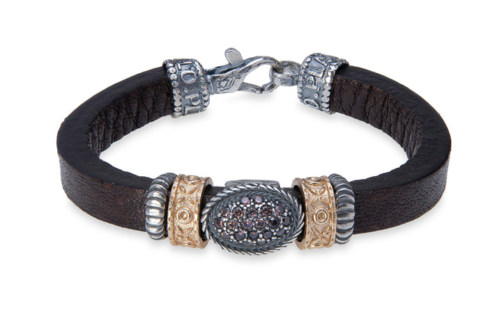 Leather bracelet with silver, bronze and zircon pieces