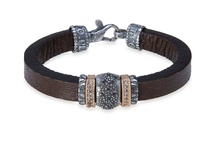 Leather bracelet with silver, bronze and zircon pieces