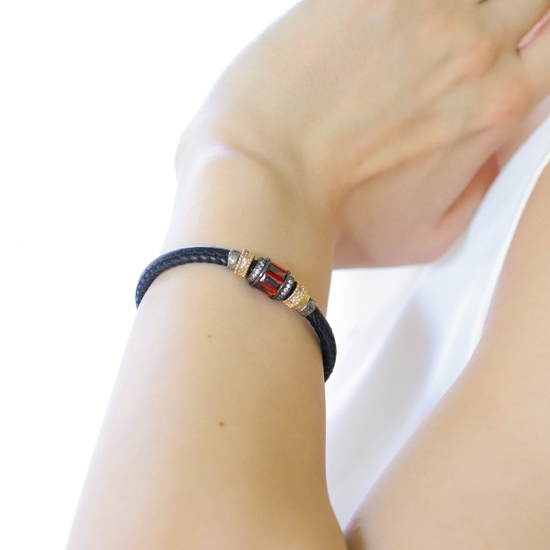 Leather bracelet with red zirconia