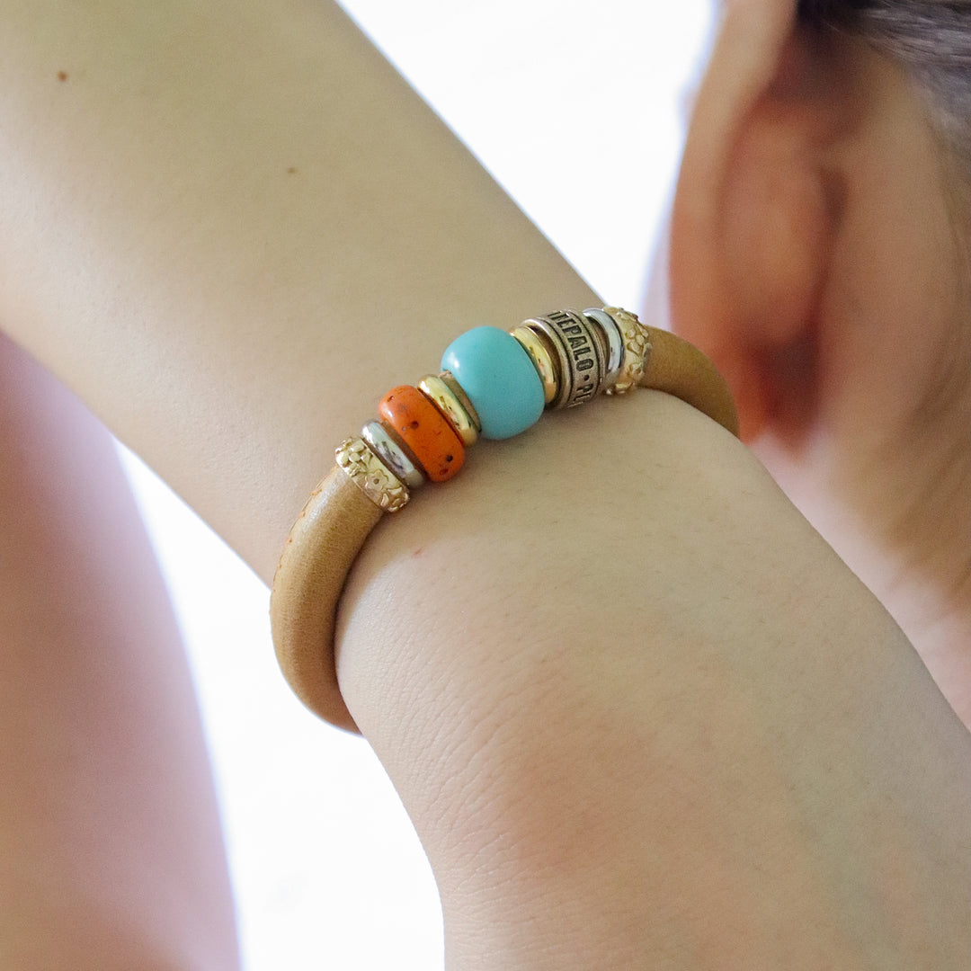 Leather bracelet with blue and orange resins