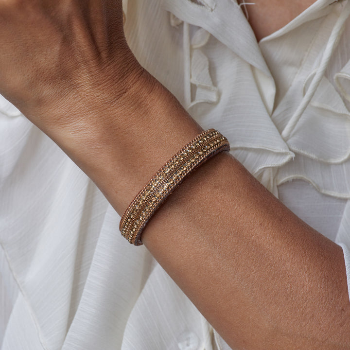 Brown leather bracelet with braiding