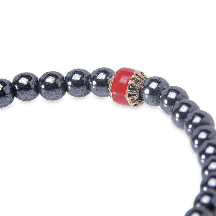 Pulsera de bolas de hematite gris con calaveras de bronce 2