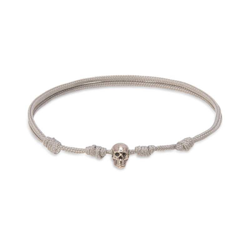 Pulsera de nylon beige con calavera de bronce 1